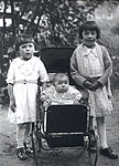 Three Children with Baby Carriage